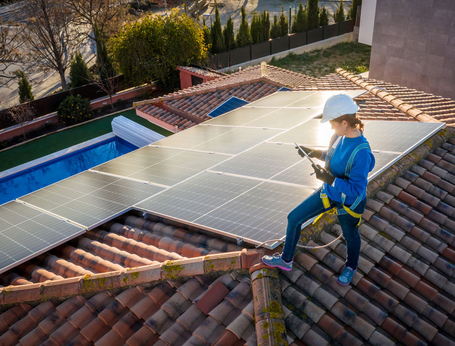 A woman installing solar panels in Dallas